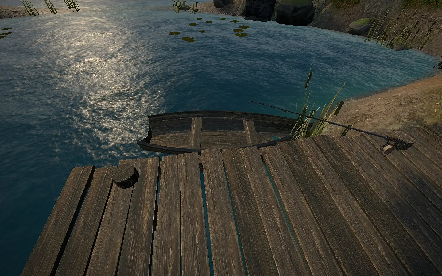 The end of the fishing pier with a small boat moored alongside.